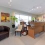 View of reception desk area with window in background peering on to Memorial Ave