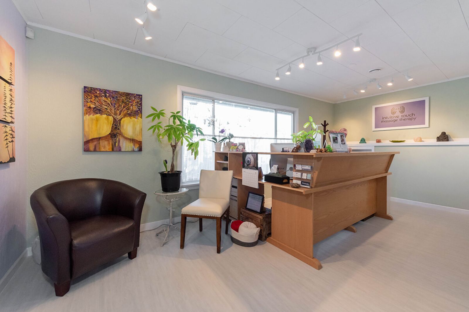 View of reception desk area with window in background peering on to Memorial Ave