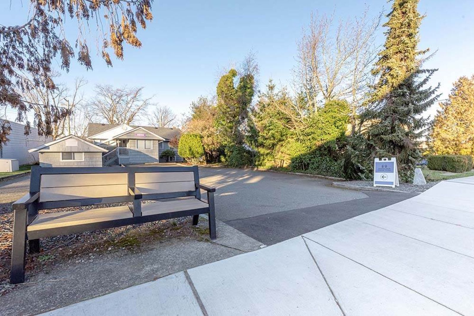 Rear parking lot view of new location for Intuitive Touch Massage Therapy in downtown Parksville, across from SOS