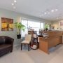 View of reception desk area with window in background peering on to Memorial Ave
